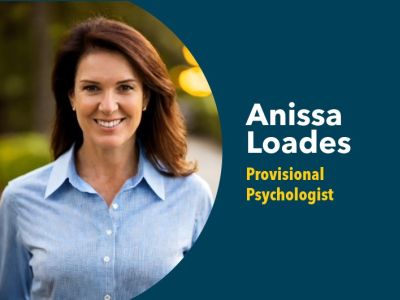 Anissa wearing a blue collared shirt