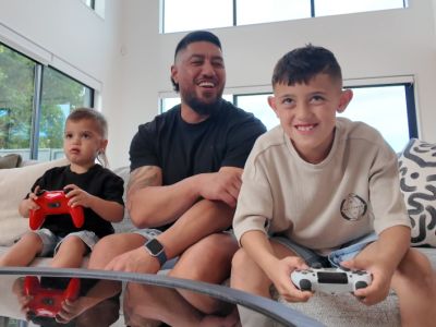 A family games together at home; a positive parenting strategy to help avoid gaming addiction in children.