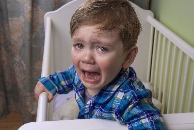 boy_little_crying_in_cot_iStock_66288077_SMALLER.jpg