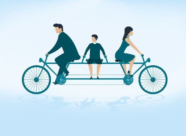 bike_riding_parents_going_opposite_directions_child_in_middle_72533647_thumbnail.jpg